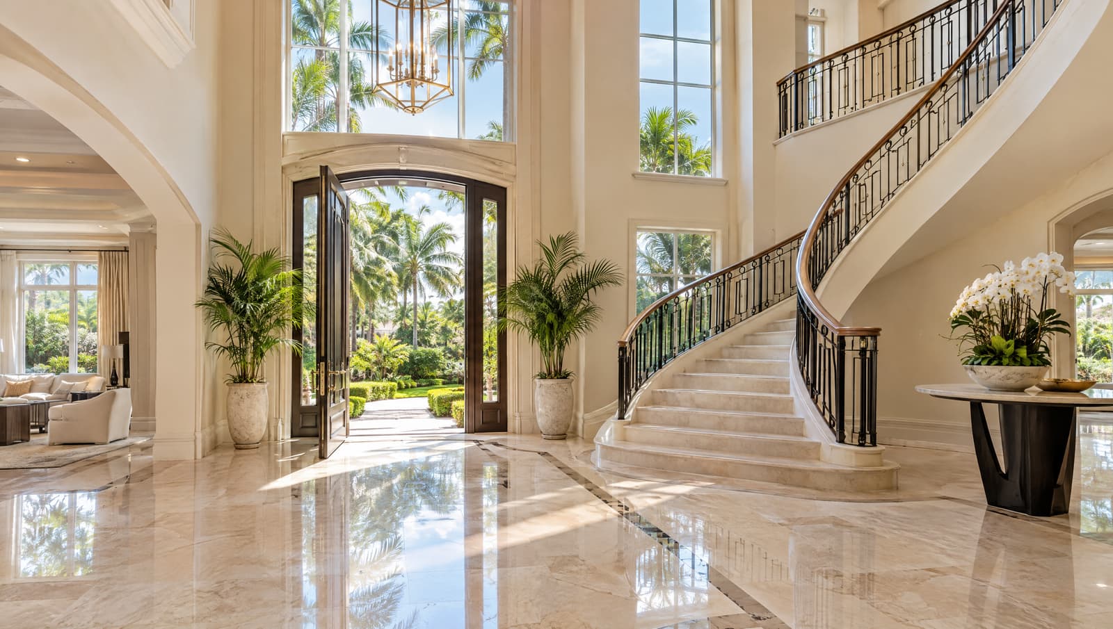 Open front door of a staged home leading into a bright foyer